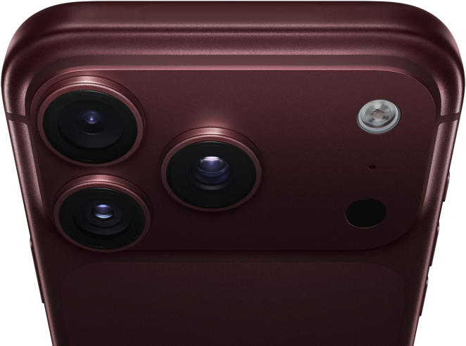 iPhone 18 Pro Max, burgundy colour (dark red), back exterior, Pro Fusion camera system at top, 3 lenses, variable aperture blades partially closed, flash, microphone and LiDAR scanner, top exterior, mobile antenna, flat sides, rounded edges