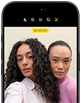 iPhone 18 Pro, black, front exterior, displaying two models posing for the camera, demonstrating the Center Stage front camera