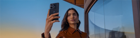 A woman taking a selfie with Motorola Signature